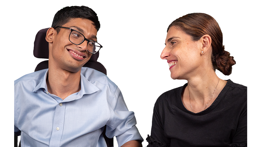 Male person with disability and support worker smiling at one another